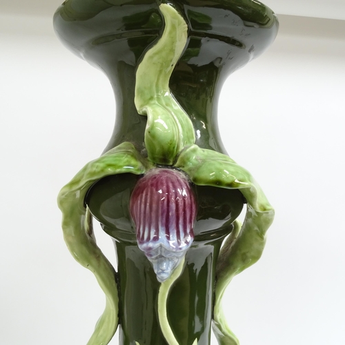 697 - A Continental Art Nouveau pottery jardiniere stand, with applied floral decoration, height 69cm