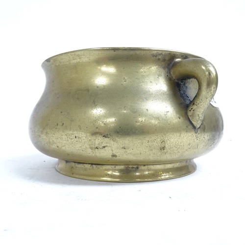 341 - A Chinese bronze censer with scrolled handles, and 6 character mark to the base, height 8.5cm