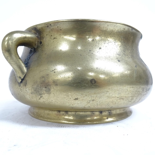 341 - A Chinese bronze censer with scrolled handles, and 6 character mark to the base, height 8.5cm