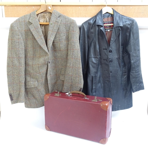 575 - A suitcase with a Harris Tweed wool jacket, a leather jacket, size XL