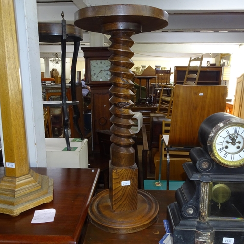 2155 - A French oak and elm spiral turned column, H81cm, and a mahogany and elm spiral turned column, H75cm... 