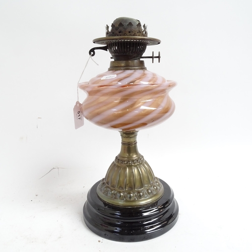 517 - A Victorian embossed brass oil lamp, with coloured glass font, chimney and cranberry glass shade, 54... 