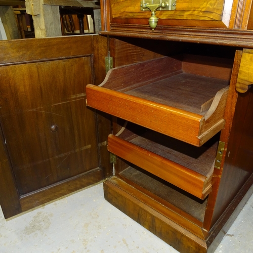 2557 - A Victorian walnut kneehole writing desk, with tooled and embossed leather skiver, drawer stamped Ma... 