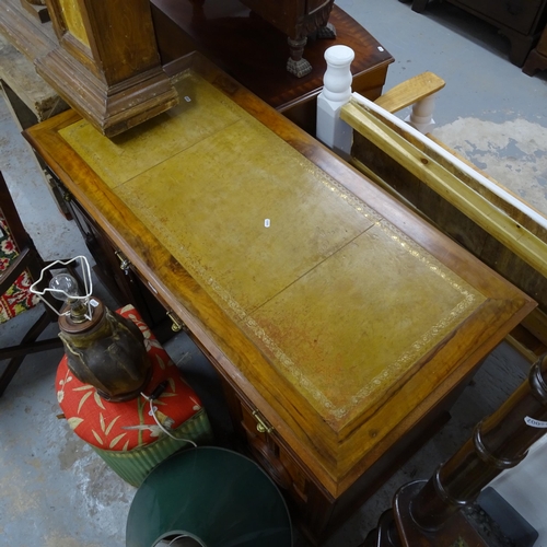 2557 - A Victorian walnut kneehole writing desk, with tooled and embossed leather skiver, drawer stamped Ma... 