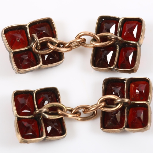 110 - A pair of flat-top garnet cufflinks, unmarked yellow metal settings, panel length 11mm, 4.1g