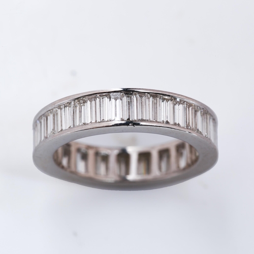 117 - A platinum diamond full eternity ring, set throughout with baguette-cut diamonds, total diamond cont... 