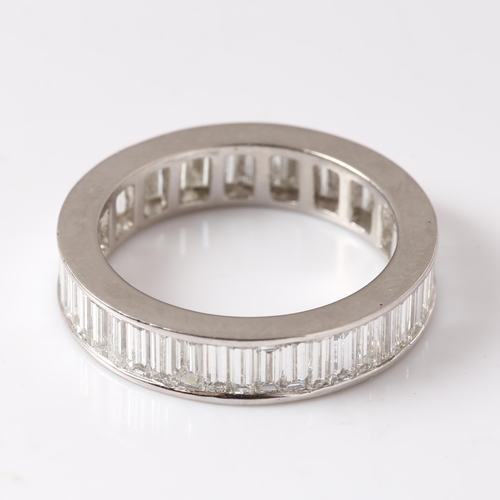 117 - A platinum diamond full eternity ring, set throughout with baguette-cut diamonds, total diamond cont... 