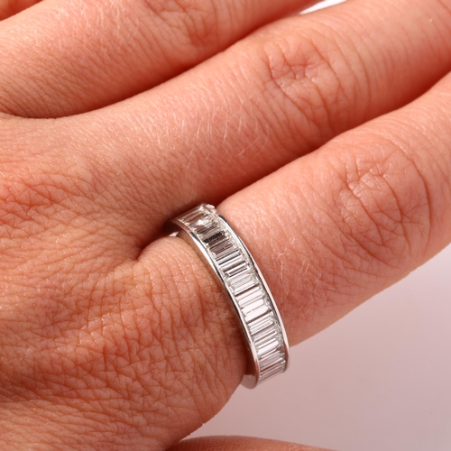 117 - A platinum diamond full eternity ring, set throughout with baguette-cut diamonds, total diamond cont... 