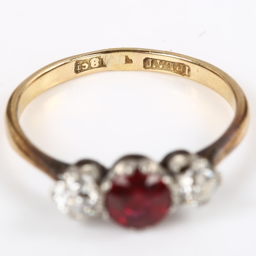 119 - An early 20th century 18ct gold three stone garnet and diamond ring, set with round-cut garnet and o... 