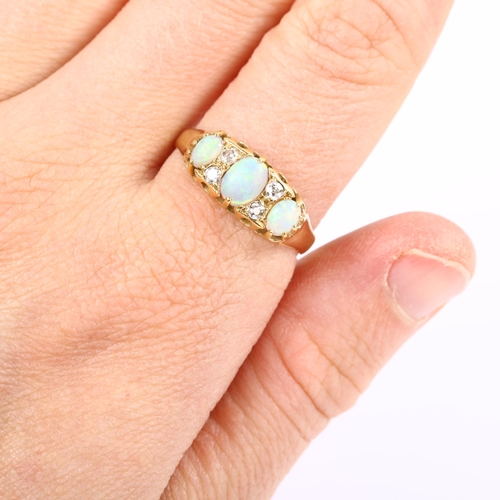 122 - An 18ct gold seven stone opal and diamond half hoop ring, set with oval cabochon opal and old and mo... 