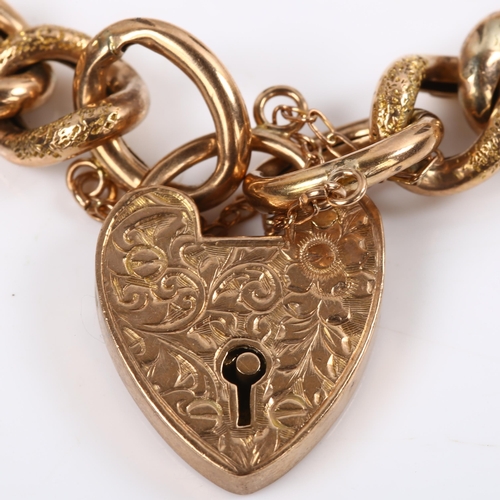 125 - An Antique 9ct rose gold hollow curb link chain bracelet, with floral engraved heart padlock clasp, ... 