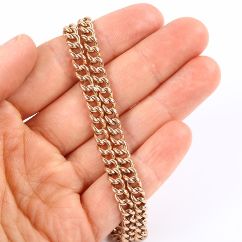 127 - A 9ct rose gold double curb link chain bracelet, with dog clip clasp, bracelet length 20cm, 22.7g