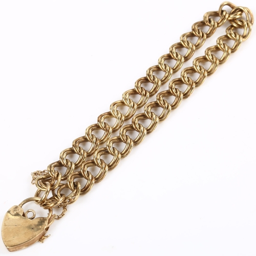 131 - A 9ct gold double curb link chain bracelet, with heart padlock clasp, bracelet length 18cm, 13.2g