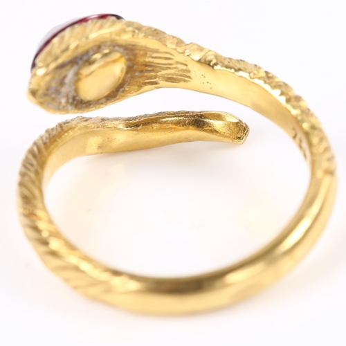 137 - An 18ct gold figural coiled snake/serpent ring, the textured head set with etched cabochon garnet, s... 