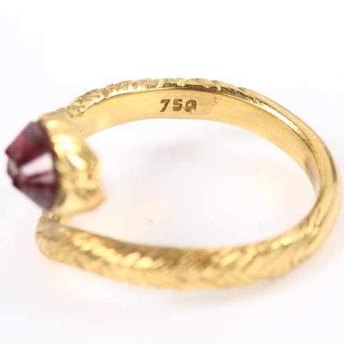 137 - An 18ct gold figural coiled snake/serpent ring, the textured head set with etched cabochon garnet, s... 