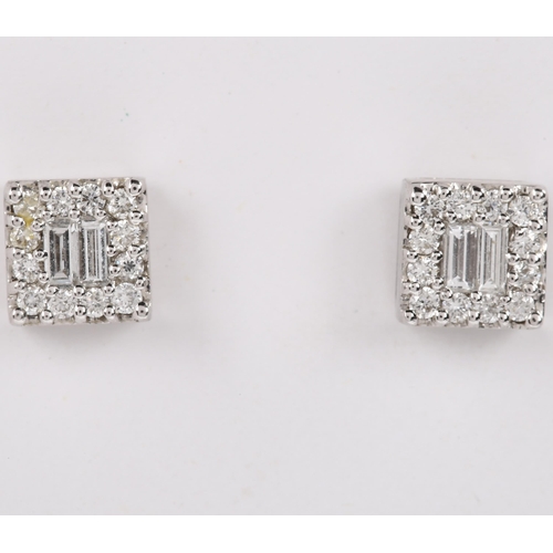 139 - A pair of 18ct white gold diamond cluster earrings, set with baguette and modern round brilliant-cut... 