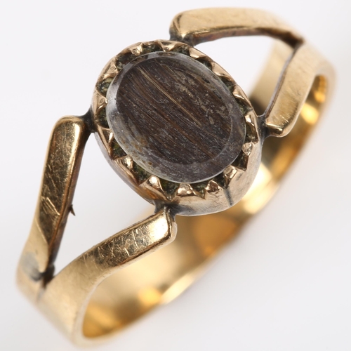 141 - A Georgian hair panel memorial ring, unmarked gold closed-back settings, with panel under glass crys... 