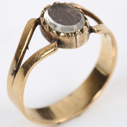 141 - A Georgian hair panel memorial ring, unmarked gold closed-back settings, with panel under glass crys... 