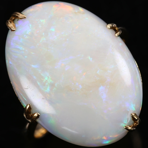 142 - A late 20th century 18ct gold white opal dress ring, set with oval cabochon opal, setting height 21.... 