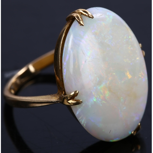 142 - A late 20th century 18ct gold white opal dress ring, set with oval cabochon opal, setting height 21.... 