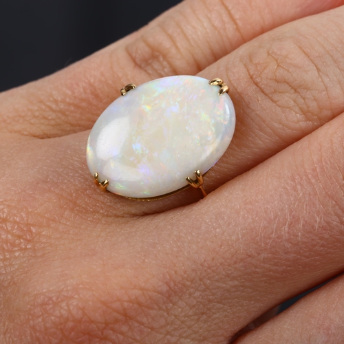 142 - A late 20th century 18ct gold white opal dress ring, set with oval cabochon opal, setting height 21.... 