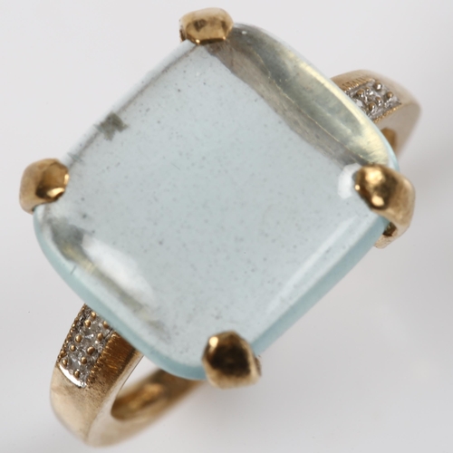 149 - A 9ct good aquamarine and diamond dress ring, set with rectangular cabochon aqua and single-cut diam... 