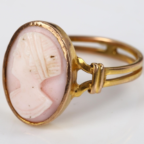 165 - An unmarked gold relief carved pink coral cameo ring, depicting female profile, setting height 16mm,... 