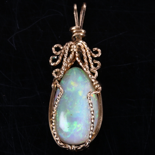 166 - A late 20th century white opal pendant, unmarked gold wirework settings with pear cabochon opal, opa... 