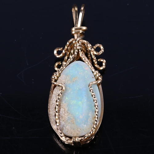 166 - A late 20th century white opal pendant, unmarked gold wirework settings with pear cabochon opal, opa... 