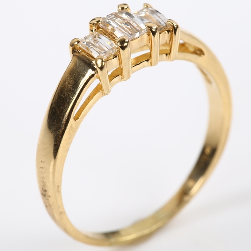 168 - A modern 18ct gold three stone diamond ring, set with rectangular barrel-cut diamonds, total diamond... 