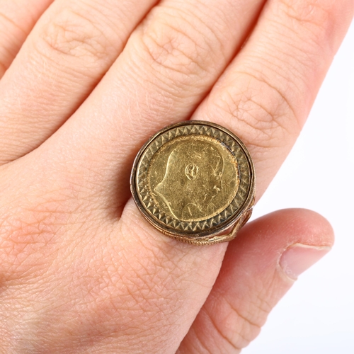 169 - An Edward VII 1907 gold half sovereign coin ring, in 9ct textured mount, setting height 22.1mm, size... 