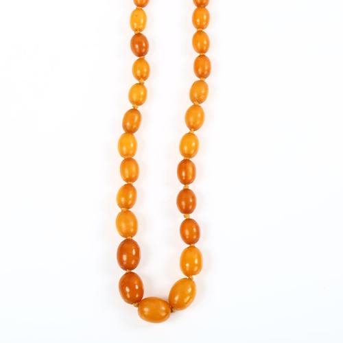 181 - A single-strand graduated butterscotch amber bead necklace, beads ranging from 12.5mm to 9.1mm, neck... 