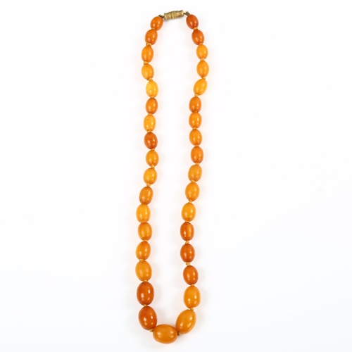 181 - A single-strand graduated butterscotch amber bead necklace, beads ranging from 12.5mm to 9.1mm, neck... 