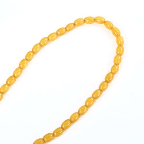 182 - A single-strand pale amber bead necklace, bead lengths 9.5mm, necklace length 42cm, 17.1g