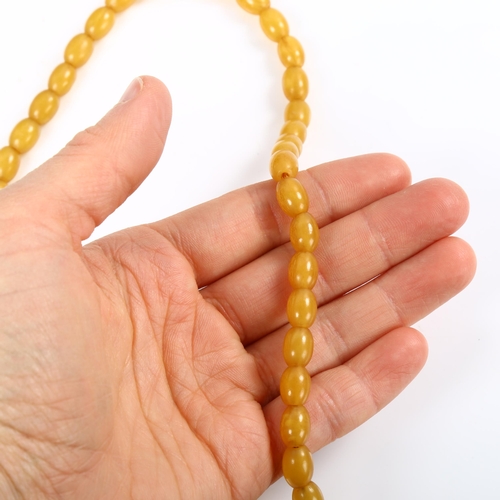 182 - A single-strand pale amber bead necklace, bead lengths 9.5mm, necklace length 42cm, 17.1g