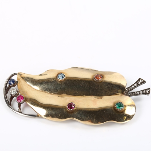 184 - A large Art Deco gem set leaf brooch, unmarked gold and silver settings, gemstones include emerald r... 