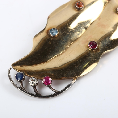 184 - A large Art Deco gem set leaf brooch, unmarked gold and silver settings, gemstones include emerald r... 