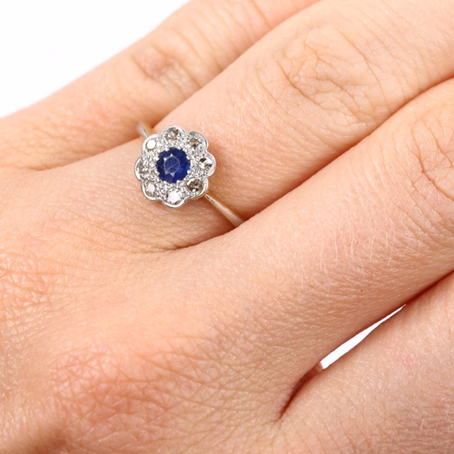 196 - An 18ct gold sapphire and diamond cluster flowerhead ring, set with round-cut sapphire and single-cu... 