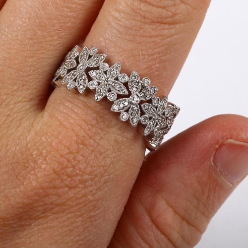 197 - A modern 18ct white gold diamond floral band ring, band width 8.4mm, size S, 7.5g