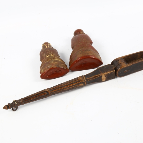 1060 - Two Burmese lacquered Buddha figures, with a Himalayan carved wood weaving tool