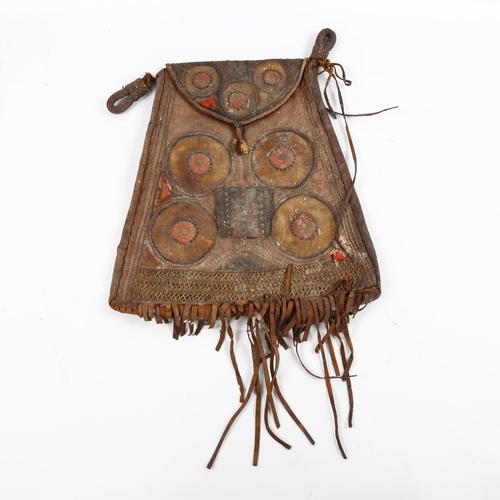 1064 - A Native American leather pouch, late 19th or early 20th century, with embroidered panels and leathe... 