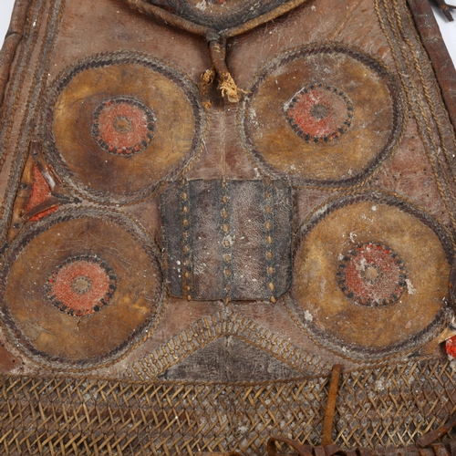 1064 - A Native American leather pouch, late 19th or early 20th century, with embroidered panels and leathe... 