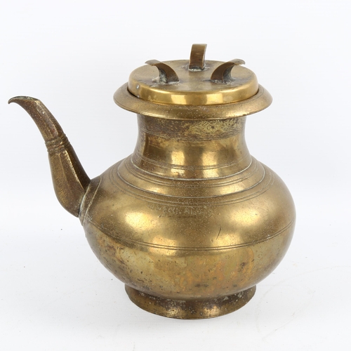 1066 - A Chinese polished bronze wine ewer and cover, height 17cm