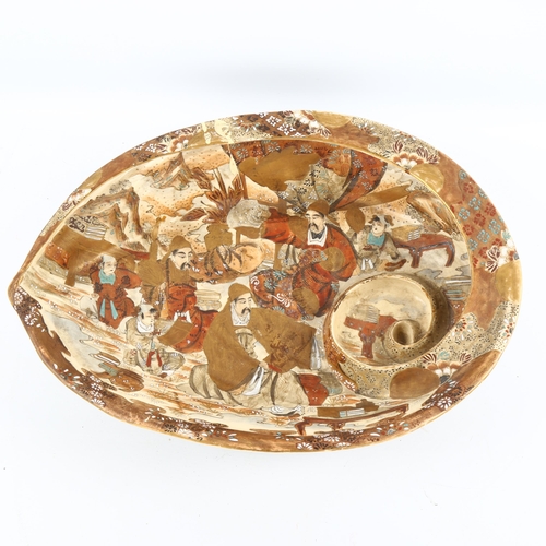 1069 - A large Japanese Satsuma porcelain conch shell-shaped table centre bowl, hand painted and gilded fig... 