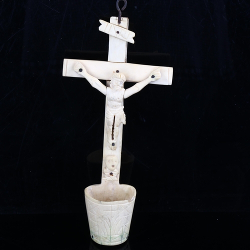 1075 - An 18th century carved bone crucifix, length 22cm