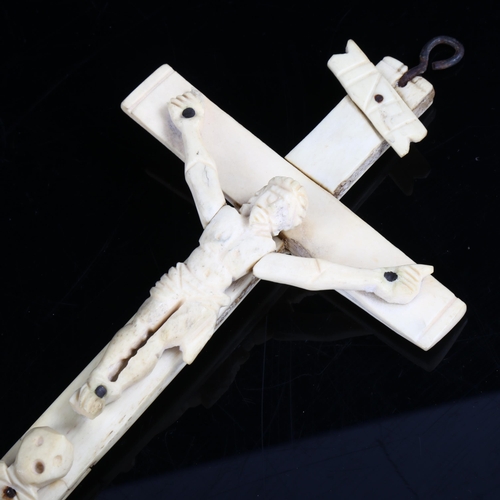 1075 - An 18th century carved bone crucifix, length 22cm