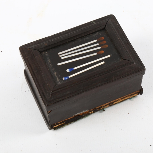 1076 - 19th century ebony matchbox with Pietra Dura hardstone inlaid match design lid, length 7cm