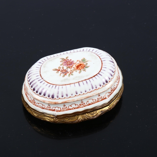 1077 - An 18th century oval porcelain snuffbox, circa 1750, the lid decorated with an Oriental scene, origi... 