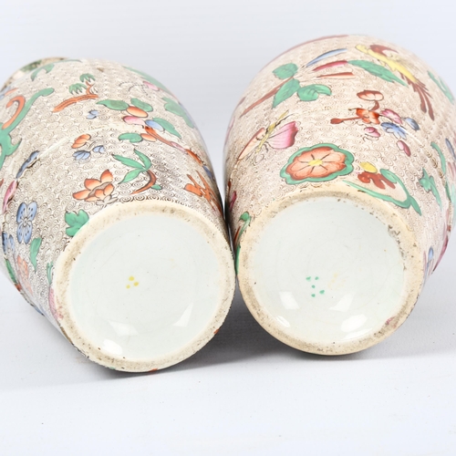 1082 - A pair of 19th century chinoiserie transfer printed vases with gilded neck handles, no factory marks... 