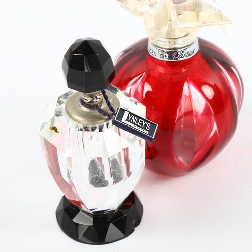 1089 - Lynley's black and clear glass perfume bottle, height 10cm, and Cartier red flash glass perfume bott... 